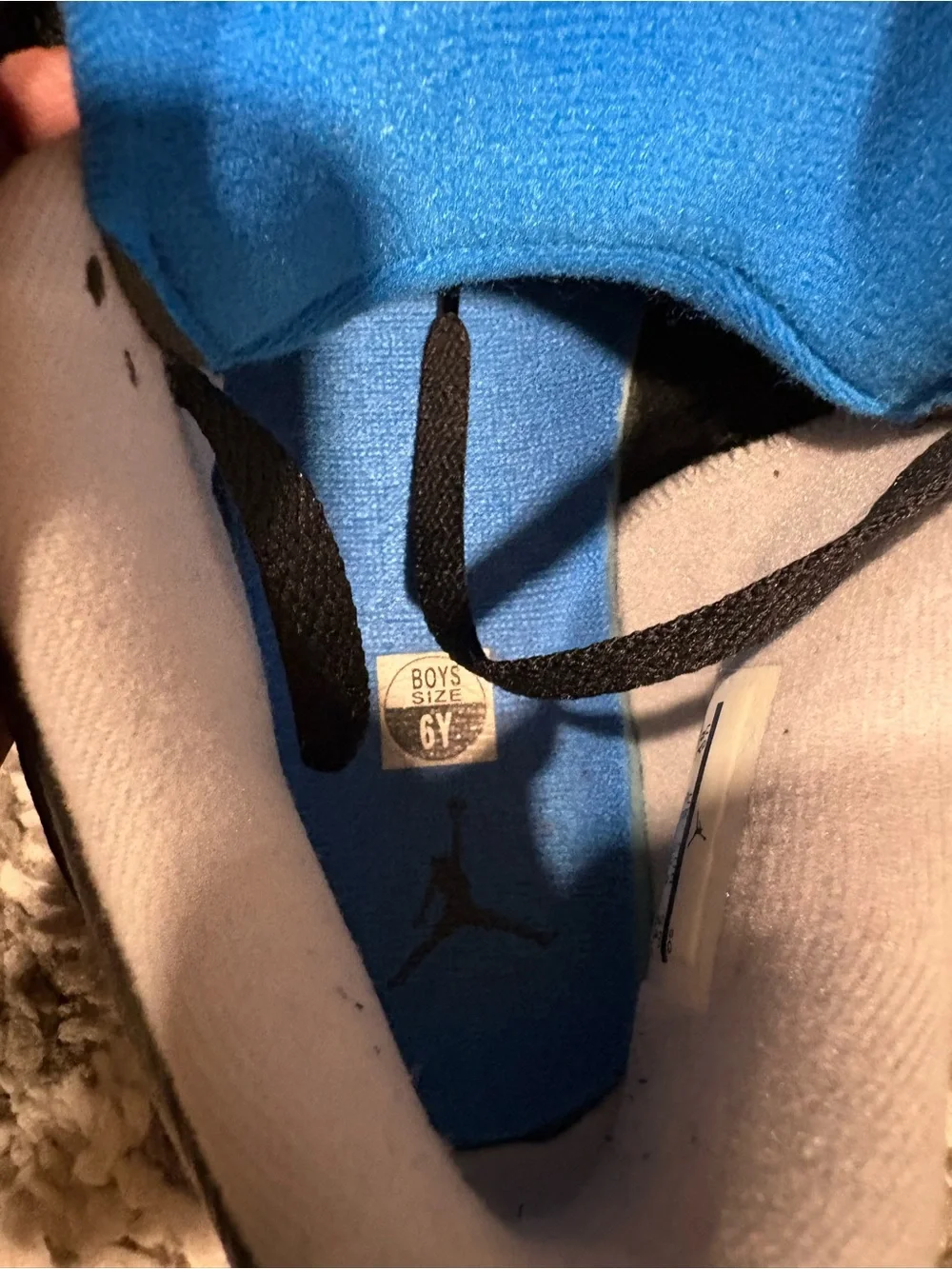 Nike Kids Black Sneakers with Blue Accents